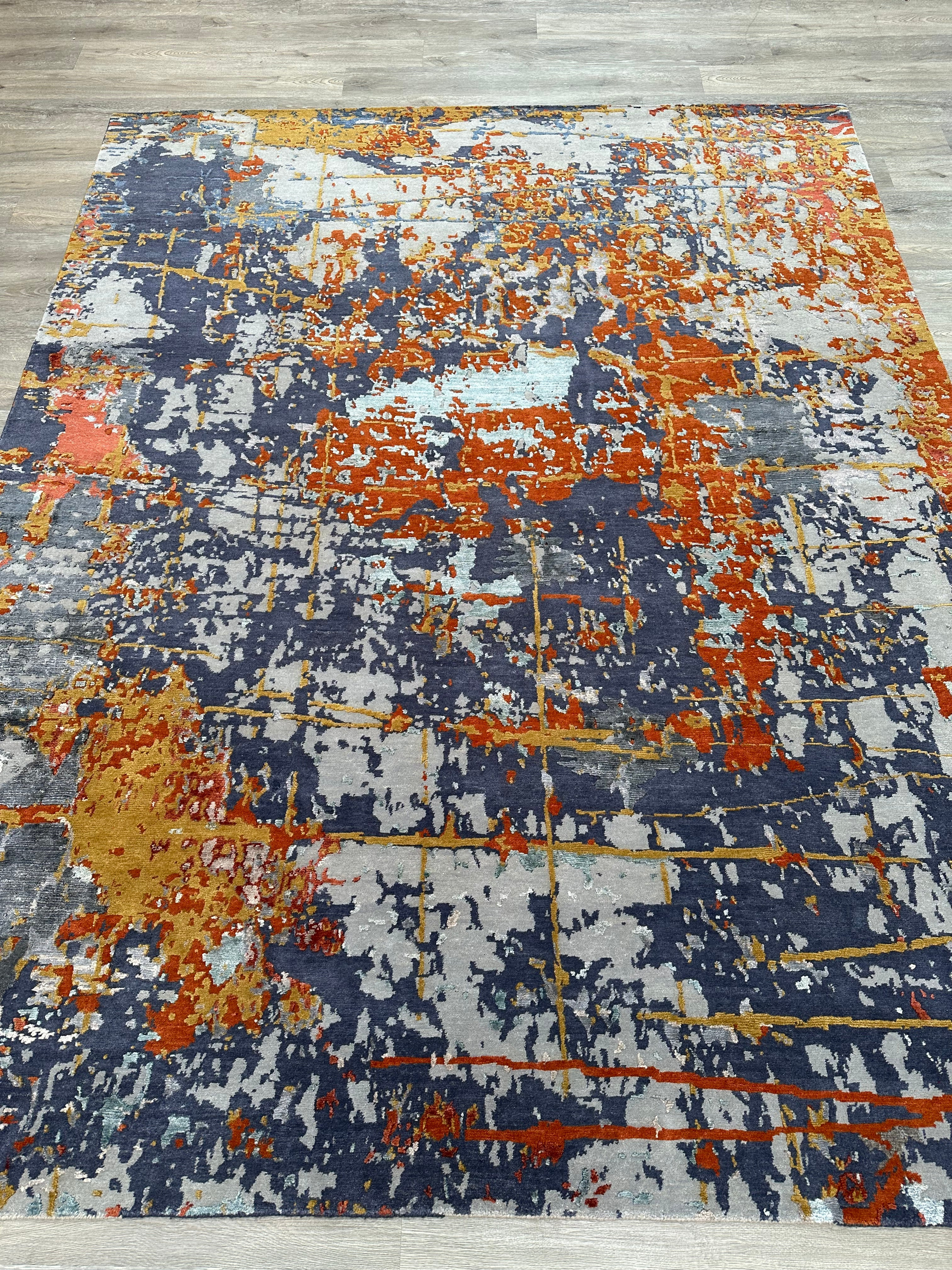 8x10 area rug with intricate patterns in a modern living room.