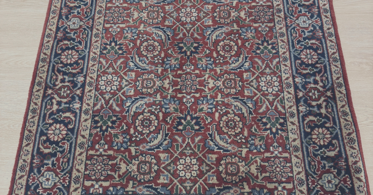 Handwoven 2'8" x 4' rug with intricate design and luxurious texture