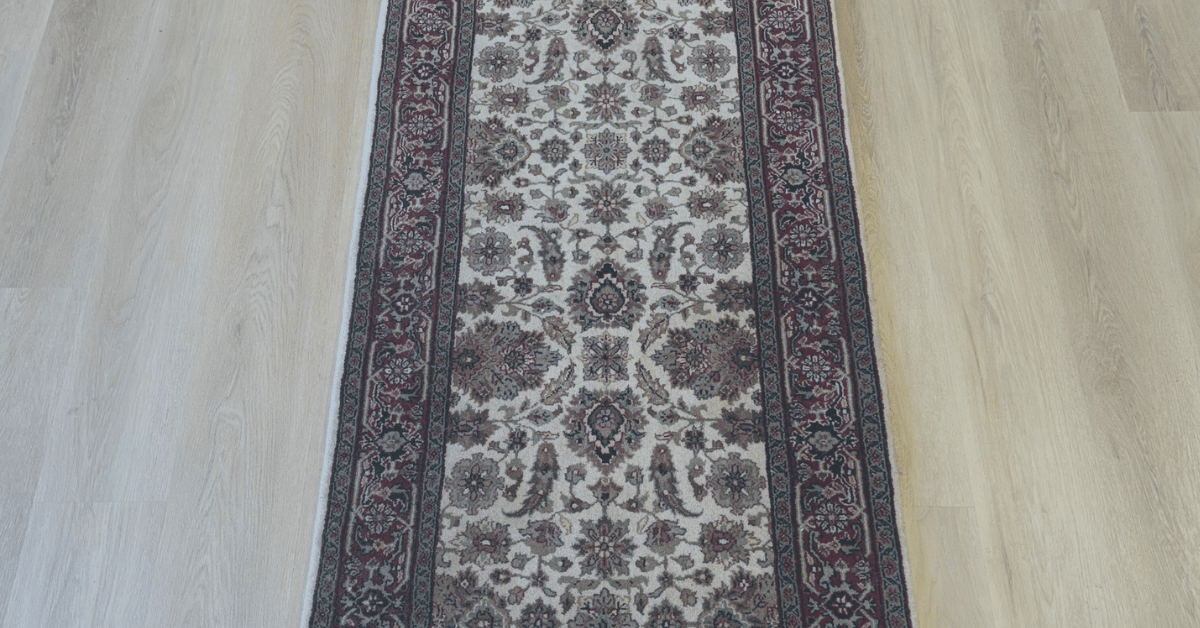 Hand-knotted carpet runner with intricate design, perfect for hallways and staircases